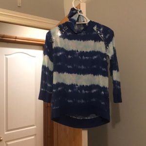 A long sleeve shirt with a hood